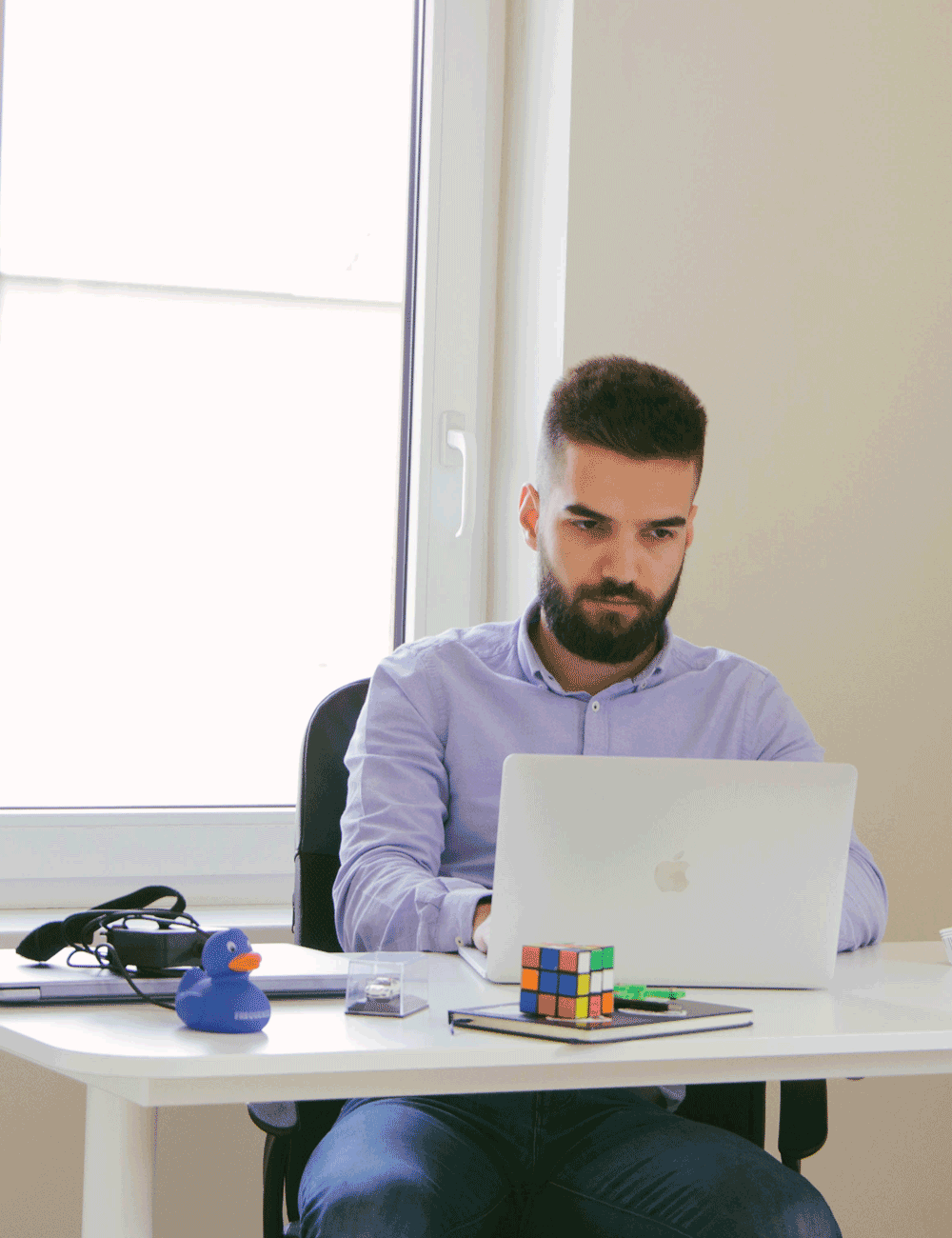 Software engineer working at his desk at Take Off Labs